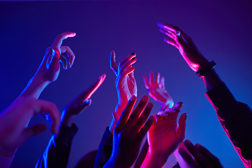 People Dancing in Neon Light Closeup