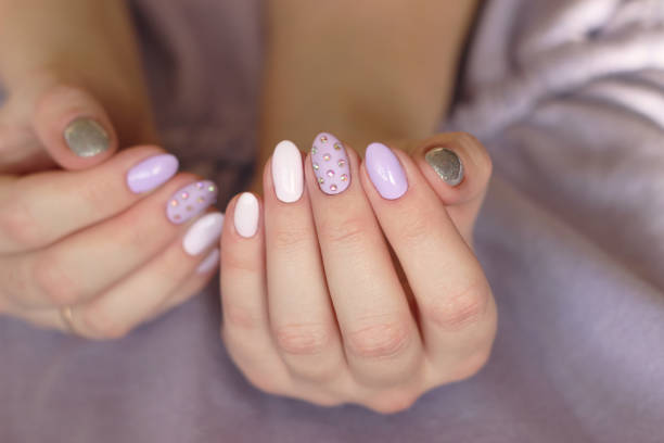 istock purple glamor manicure two hands 1387281909