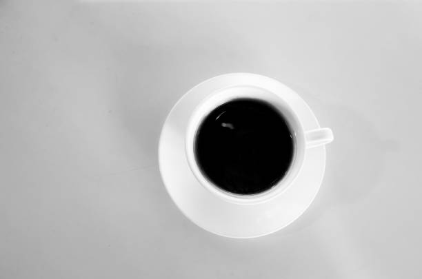 black coffee on a white table photo in the early morning