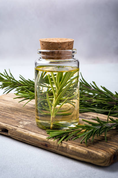 istock Glass jar of olive oil with kitchen herbs 1387283247
