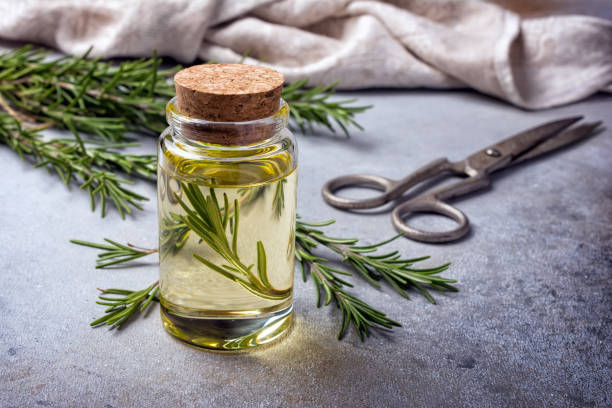 istock Glass jar of olive oil with kitchen herbs 1387283804