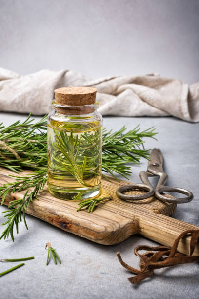 istock Glass jar of olive oil with kitchen herbs 1387283835