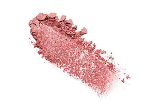 Broken pink color eyeshadow or blusher as samples of cosmetic beauty products