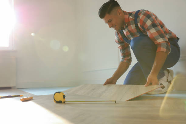 istock Professional worker installing new parquet flooring indoors 1387285990