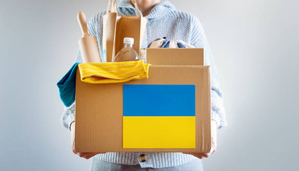 istock Volunteer holding a box with help for Ukrainian people 1387286037
