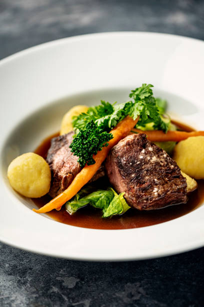 veal medallions with seasonal vegetables. - red meat meat dish grilled rare imagens e fotografias de stock