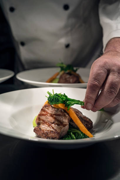 istock Chef Preparing Food At The Pass 1387286203