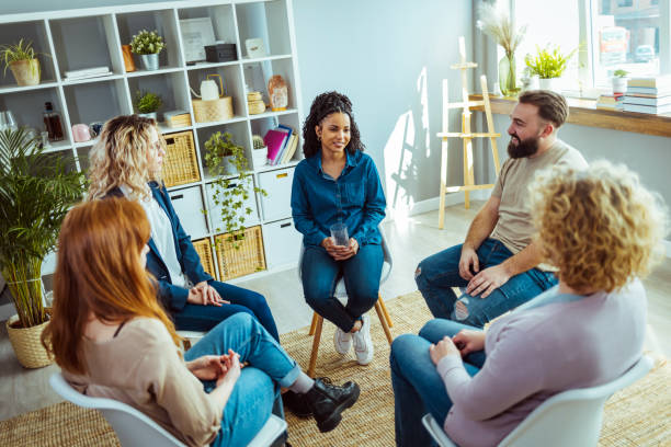 People participating in group therapy for PTSD People participating in group therapy for PTSD post traumatic stress disorder photos stock pictures, royalty-free photos & images