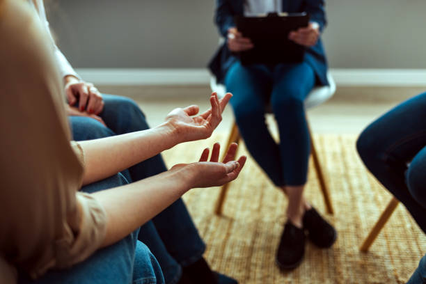 istock People Attending Support Group Meeting For Mental Health Or Dependency Issues In Community Space 1387286499