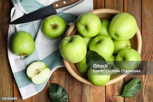 Fresh Ripe Green Apples And Knife On Wooden Table Flat Lay Stock Photo - Download Image Now