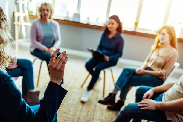 istock School counselor discusses something with adult students 1387286692
