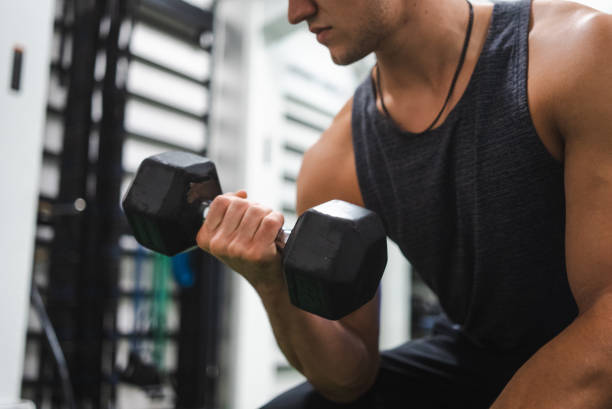 istock Young Adult Male Gym Workout 1387290179