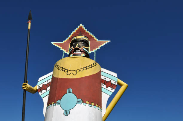 Oversize kachina sculpture at National Route 66 Museum in Oklahoma Elk City, OK, USA, Oct. 11, 2019: A colorful kachina sculpture nicknamed Myrtle stands outside the National Route 66 Museum in Elk City, Oklahoma. The metal statue used to stand at the former Queenan's Trading Post. kachina doll stock pictures, royalty-free photos & images