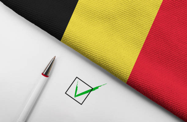 Pencil, Flag of Belgium and check mark on paper sheet