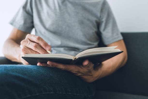 istock Man working or studying with book . Business and education concept 1387294547