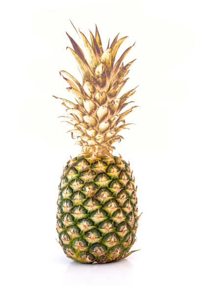 istock Pineapple in gold isolated on white background 1387298229