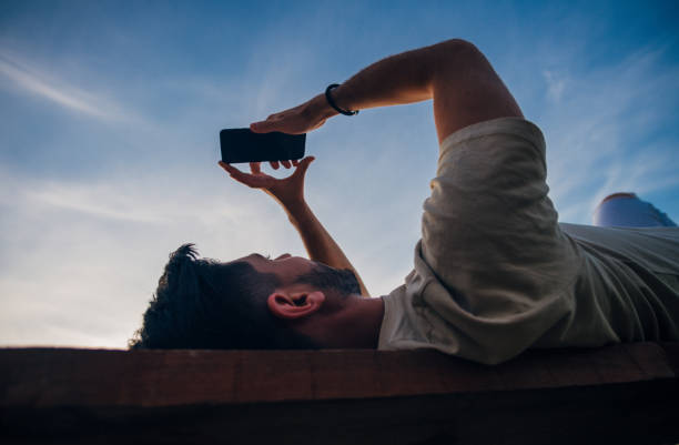 istock Self employed man lying and resting on the bench 1387301636