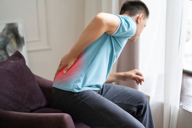 istock Back pain, kidney inflammation, man suffering from backache at home 1387304053