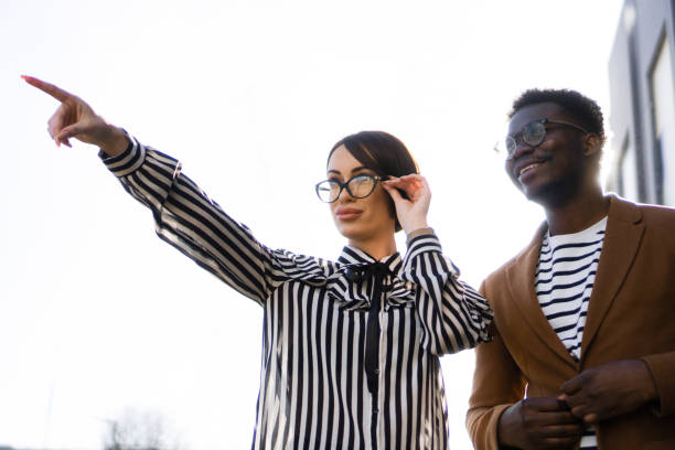 istock Two young colleagues looking at distance 1387309001