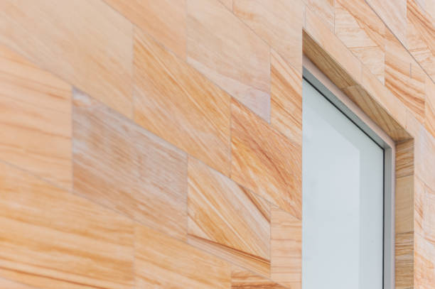 istock Side on image of a sandstone wall with frosted glass window 1387310412