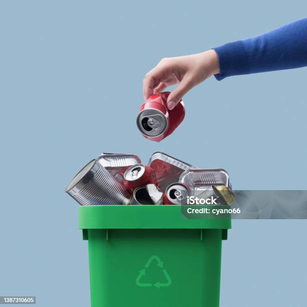 Woman Throwing A Can In The Recycling Bin Stock Photo - Download Image Now - Recycling, Garbage, Aluminum