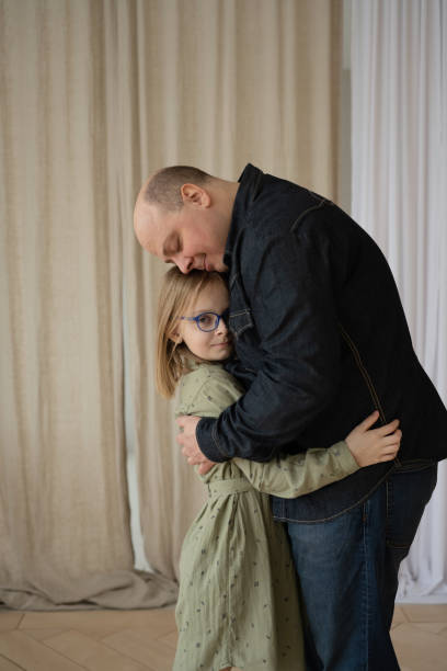 istock Dad and daughter spend a good time, hugging. 1387311779