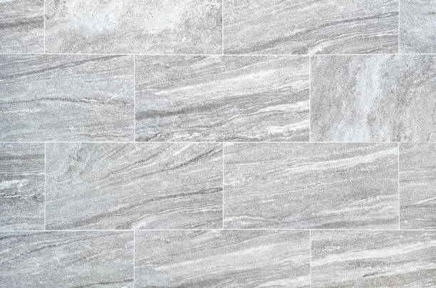 istock grey travertine marble tile patterned use as background for luxury and elegance concept.  bright grey marble texture abstract background pattern or marble tile wall. 1387312158