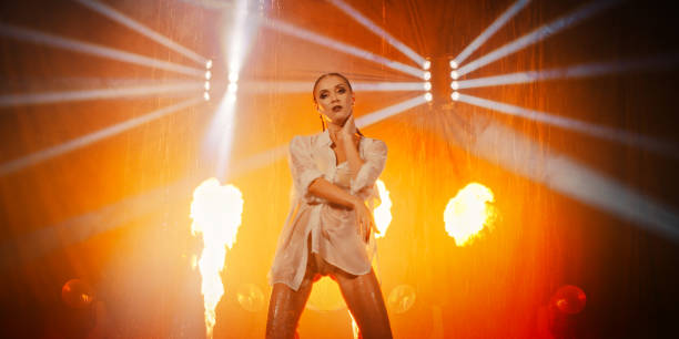 istock Woman performing on a stage in the rain 1387314701