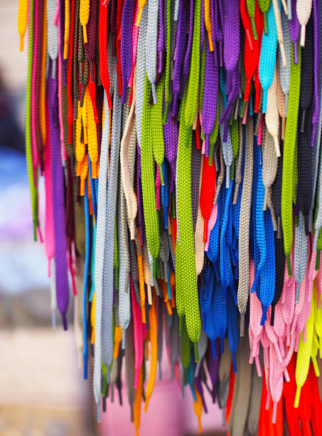 istock Colored bright shoelaces hang in the store. 1387314787
