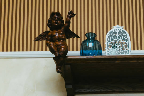 istock Wooden Cupid Figurine 1387317101