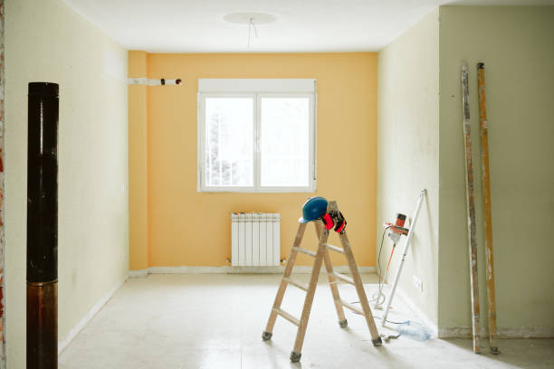 istock ladder, blue protective helmet and ear defenders at construction site. Home improvement, renovation 1387317848