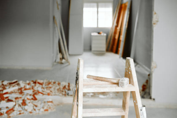istock ladder, hammer and debris at home construction site. Home renovation 1387317859
