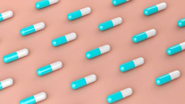 istock Medical drug pill capsules in rows, 3d illustration 1387318019