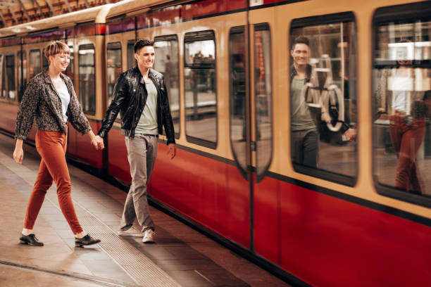 istock couple waiting the train 1387318433