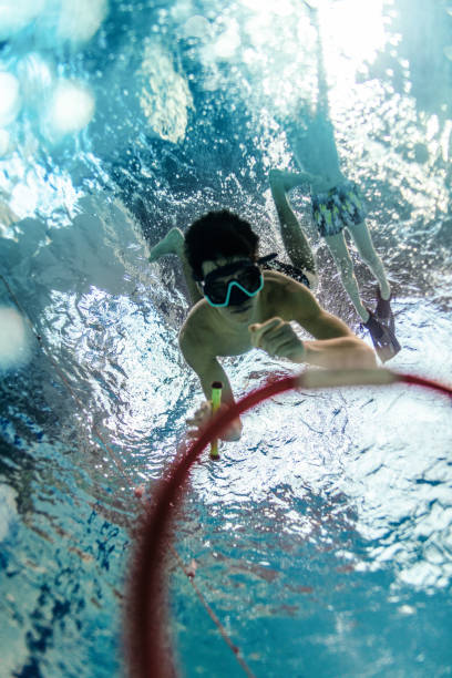 istock Children on training in swimming pool 1387319642