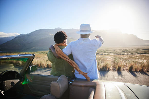 istock Loving couple enjoying the view during a break from a drive together 1387321977