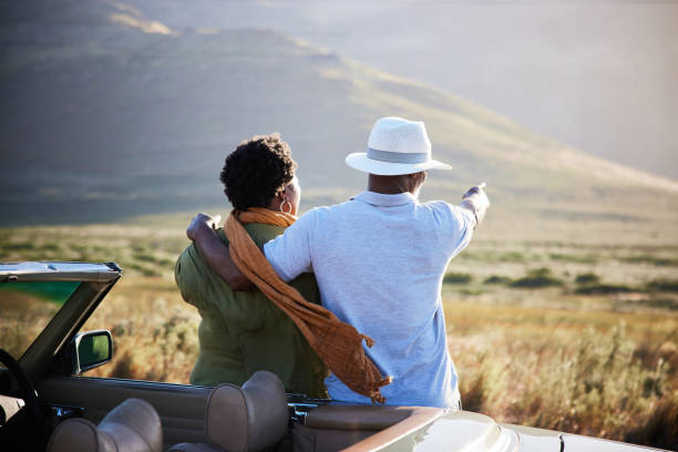 istock Affectionate couple enjoying the view during a break from a drive together 1387322020