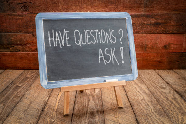 istock Have questions? Ask! Handwriting in chalk on blackboard. 1387322250