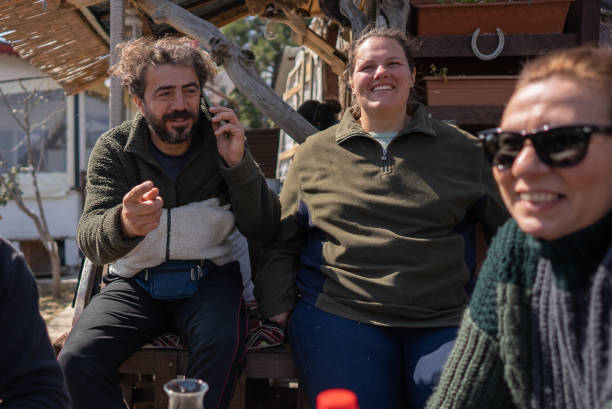 istock Multi ethnic group friends having fun and talking on phone . 1387322280