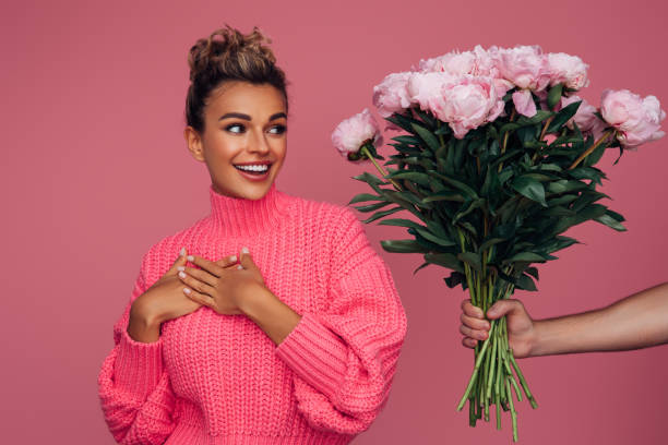 istock Young girl accepting flowers 1387323312