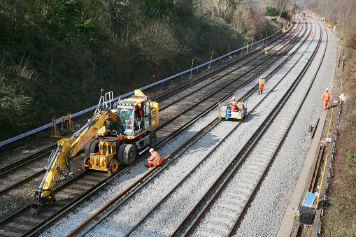 Haywards Heath / UK - March 01, 2022: Railway workers on site during a  track ballast replacement project