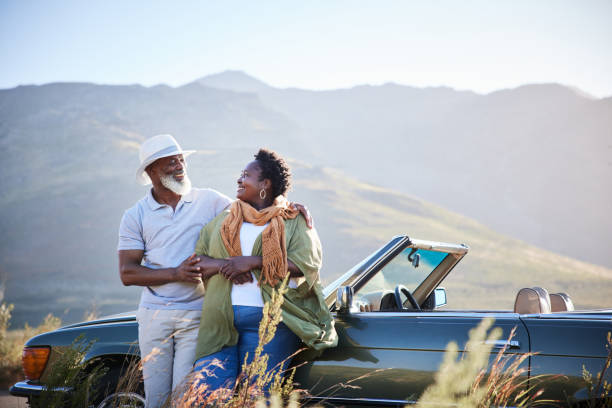 istock Smiling mature couple taking a break from a scenic road trip 1387323458