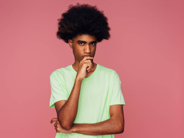 istock Portrait of emotional afro guy 1387323941