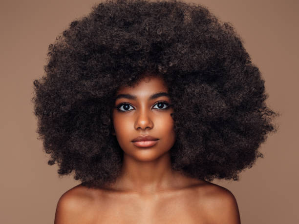 istock Beautiful girl with curly hairstyle 1387323976