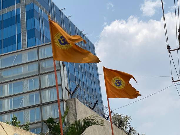 istock Hanuman temple flags with office building background 1387324957