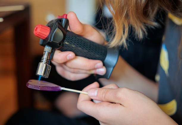 istock using kitchen burner to make a homemade lollipop candy store 1387325569
