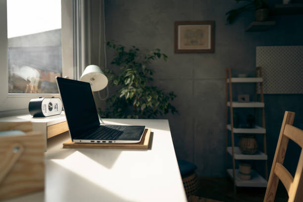 istock Minimalist home office, with laptop on the desk 1387326496
