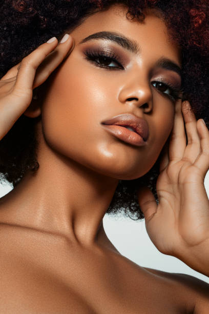 istock Beautiful afro woman with perfect make-up 1387326502