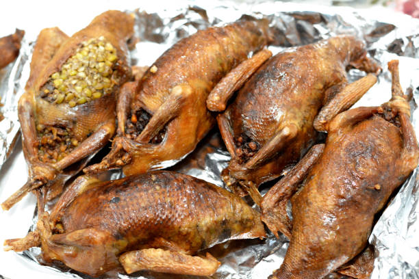 Egyptian Hamam Mahshi or stuffed squab, An Arabic cuisine, Egyptian traditional stuffed pigeon dish filled with rice and Freekeh Egyptian Hamam Mahshi or stuffed squab, An Arabic cuisine, Egyptian traditional stuffed pigeon dish filled with rice and Freekeh which is a cracked green wheat grains, oriental roasted pigeons meal squab pigeon meat stock pictures, royalty-free photos & images