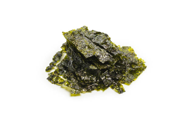 istock Tasty nori seaweed isolated on white background. 1387329718